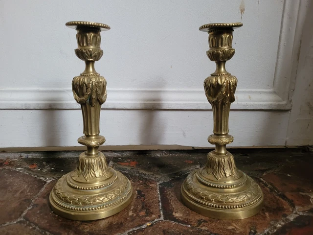 Paire de flambeaux style Louis XVI bronze ciselé doré