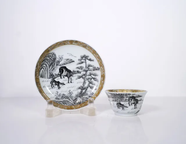 A Grisaille Decorated 'Buffalo' Cup and Saucer
