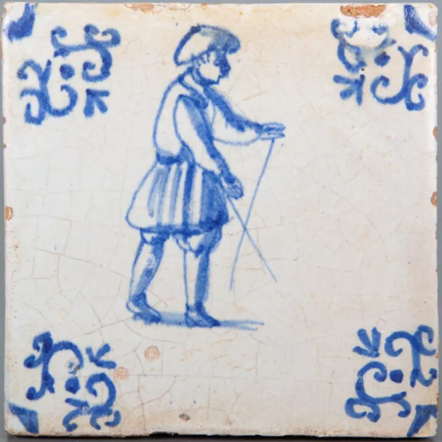 Nice Dutch Delft Blue tile, man with sticks, first half 17th century.