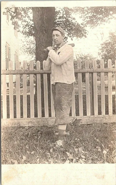 RPPC Uniformed Baseball Player posing in Front Yard with Bat early 1900s