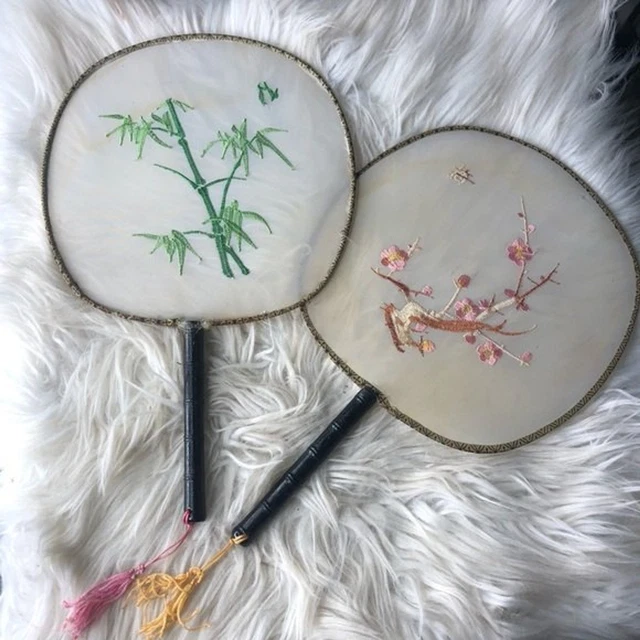 Vintage oriental hanging wall fans with tassles