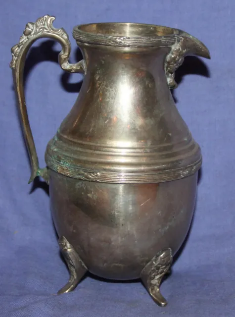 Antique ornate silver plated footed milk jug creamer pitcher