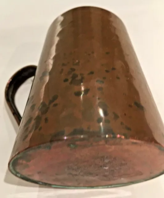 An Arts and Crafts Beaten Copper Tankard