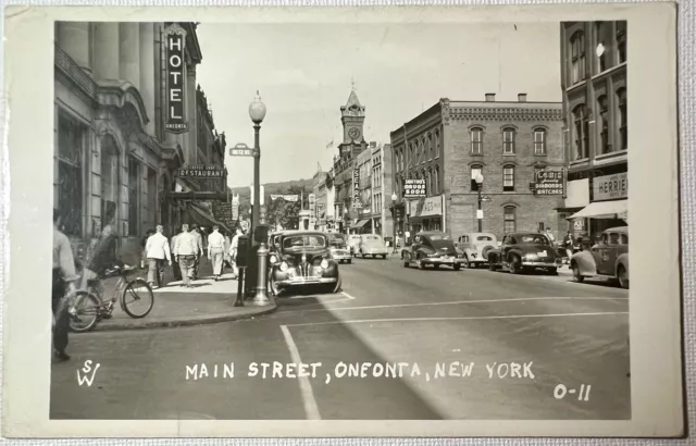 Vtg 1947 Posted RPPC Postcard Main St Oneonta NY Busy W/ Bldgs Cars People Bikes