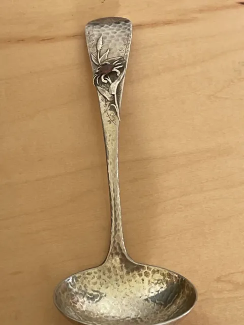 sterling 7 inch serving ladle.  hammered with copper application. So beautiful 