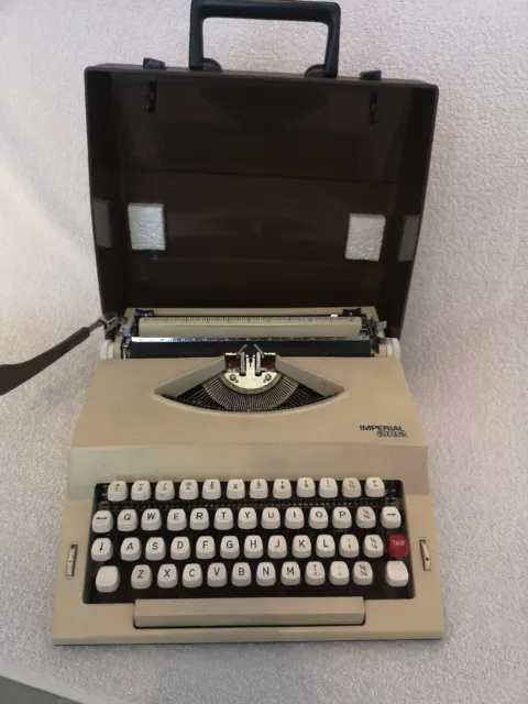 Máquina de escribir Imperial portátil vintage retro década de 1970 con estuche