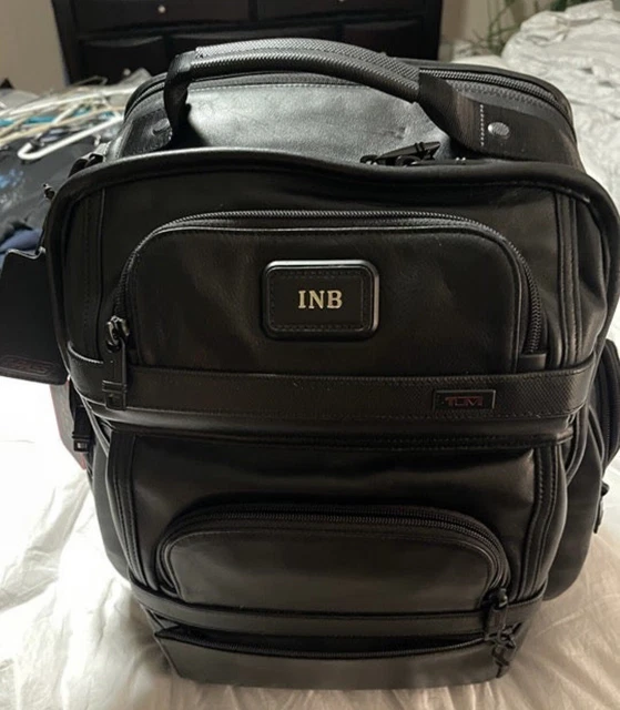 Tumi T-PASS Alpha 2 backpack. leather mint condition. hardly been used authentic