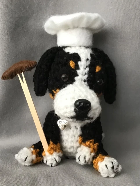 Bernese Mountain Dog Wearing A Chef  Hat And Holding Barbeque  Sausage On A Fork