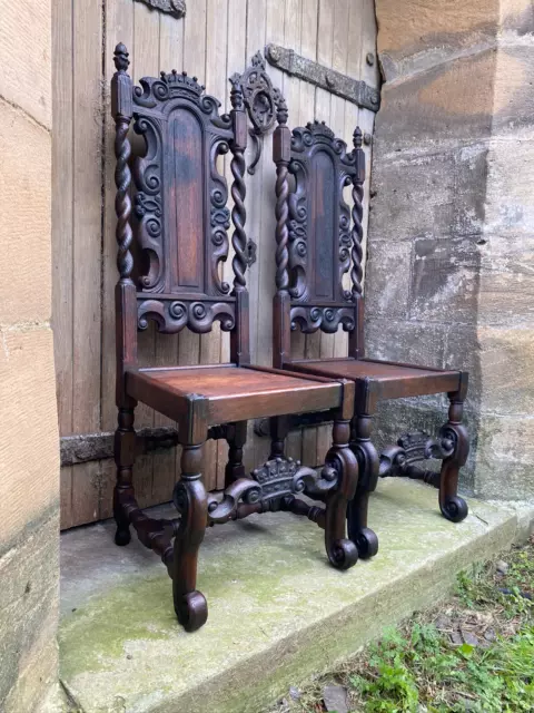 Splendid pair of early carved oak Carolean chairs