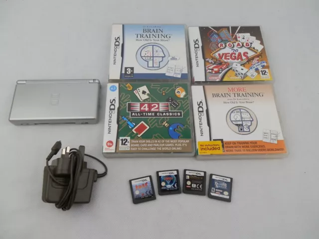 NINTENDO DS Lite Silver bundled with a tonne of games charger, black stylus.
