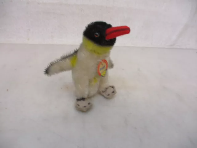 x-29562	Steiff Pinguin Peggy, H. ca. 8,5 cm, mit Schild, ohne Knopf und Fahne