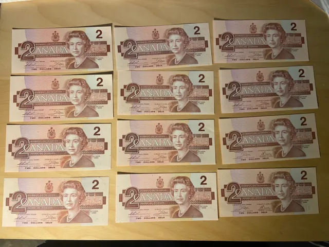 1986 Lot Of 12 Canada Uncirculated 2$ Two Dollar Bank Notes