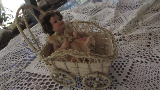 Vintage Wicker Pram with  Porcelain Doll : Sitting & Moves Pretty