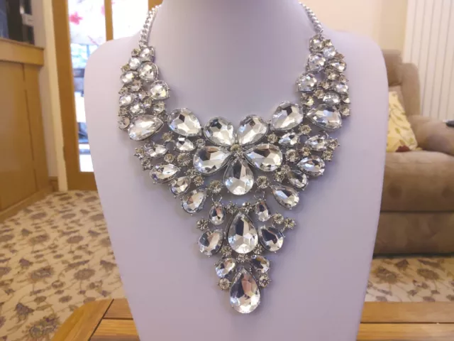 Brand new large silver tone statement necklace with large clear crystal