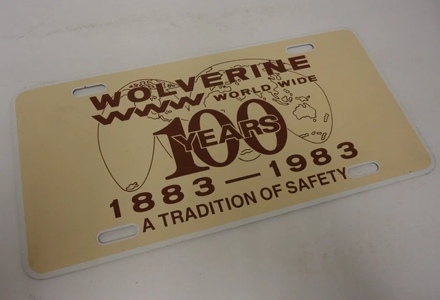 vintage wolverines world wide shoes/boots advertising license plate tin sign