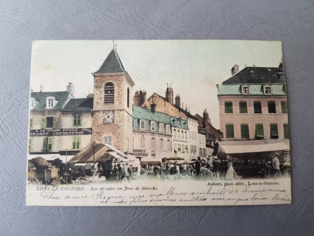 CPA / Carte postale ancienne - LONS LE SAUNIER Les Arcades Jour de Marché (39)