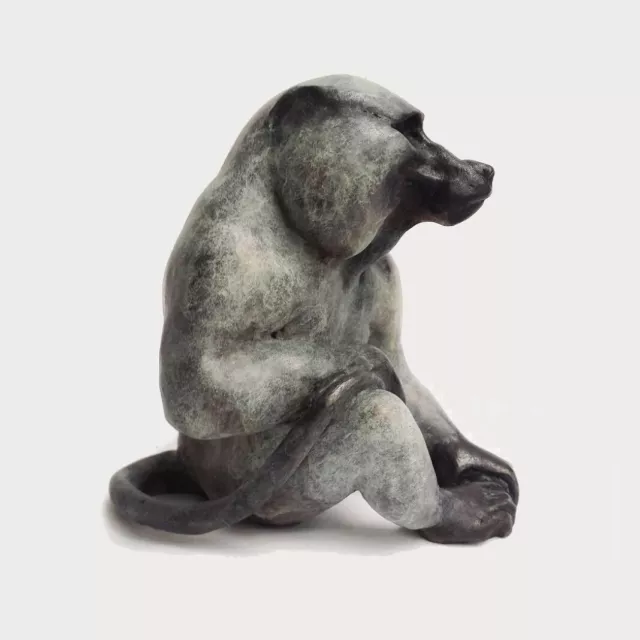 Enjoy a quiet moment alongside this African baboon, cast in solid bronze