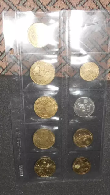 9 pieces jetons touristique   monnaie de paris dans leur pochette à voir