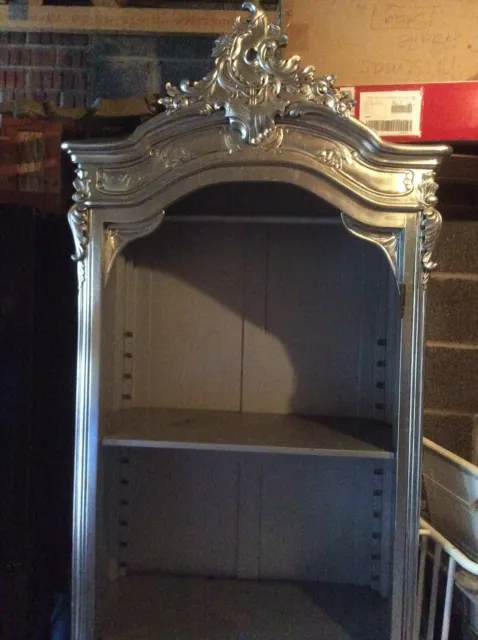 Silver Armoire Wardrobe Used In Shop Display.