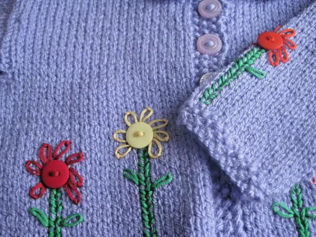 HAND KNITTED GIRLS “I AM BLOOMING” CARDIGAN. AGE 0-3m.