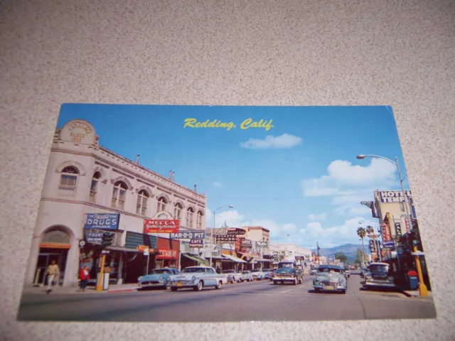 1950s REXALL DRUGS, MAIN STREET SCENE, DOWNTOWN REDDING CA. VTG POSTCARD
