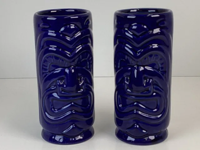 Two blue ceramic high gloss tiki mugs 6 inches tall 2 1/2 inches wide