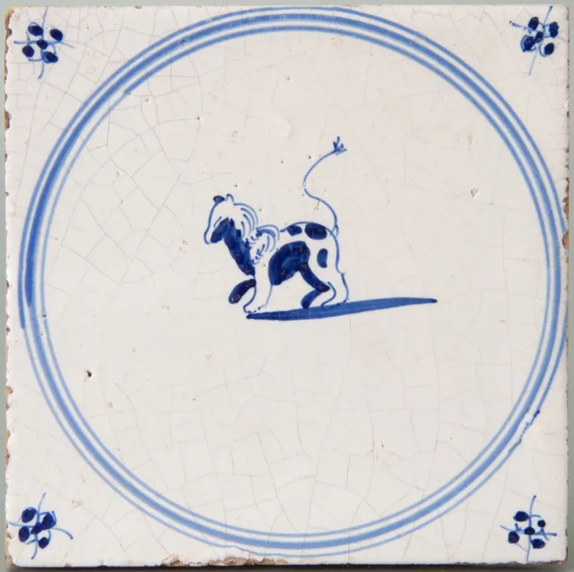 Nice Dutch Delft Blue animal tile, dog in a circle, circa 1800.