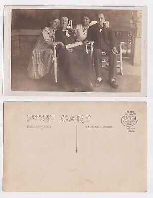 Multi generation family group on porch RPPC c1920s Unposted