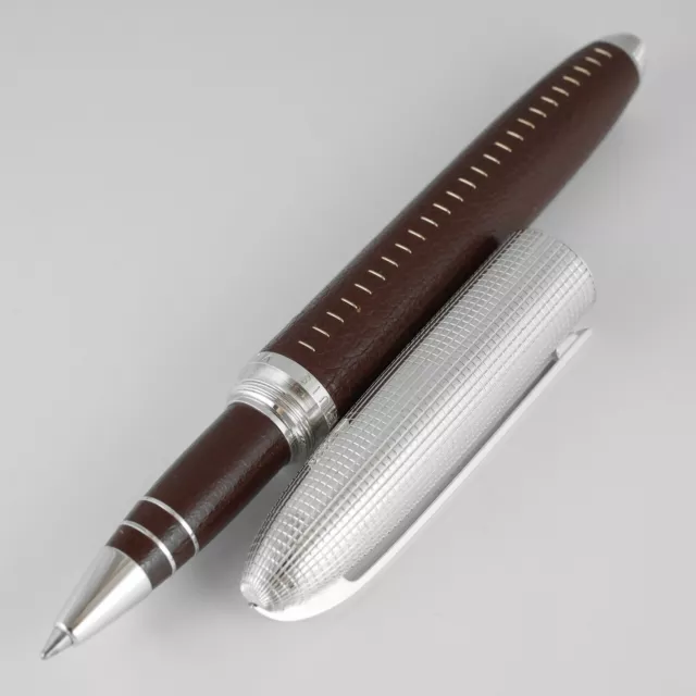 LOUIS VUITTON PEN IN SILVER AND BROWN LEATHER. Art - Other - Auctionet