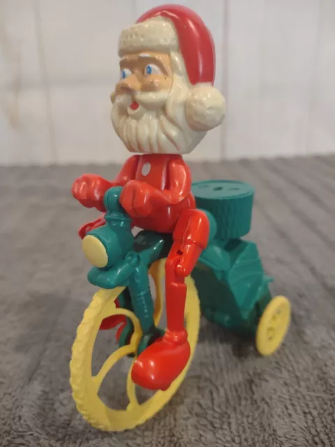 Vintage Christmas Collectible SANTA TRICYCLE Plastic Mechanical Wind Up Toy Bike