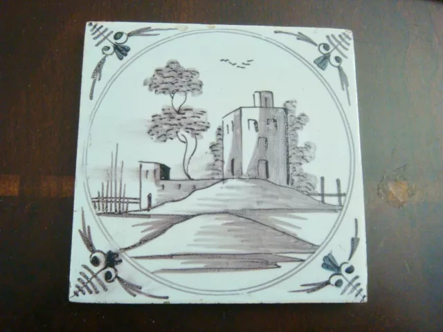 18th century salvaged Delft manganese tile depicting  buildings and trees