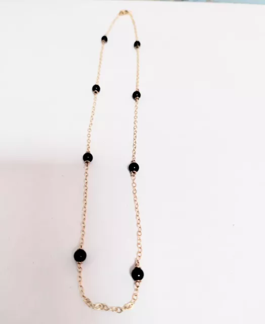 Stunning 9ct gold Necklace with 8 Black Onyx Beads.