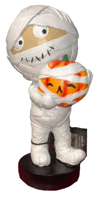 CR Curious- Mummy Boy Holding Pumpkin Figurine. Brand new