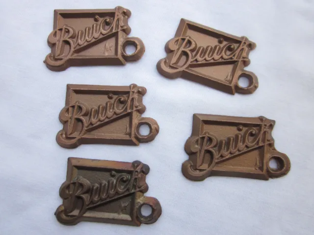 5 vintage brass Buick key fobs, rare cast souvenirs for Buick Club America