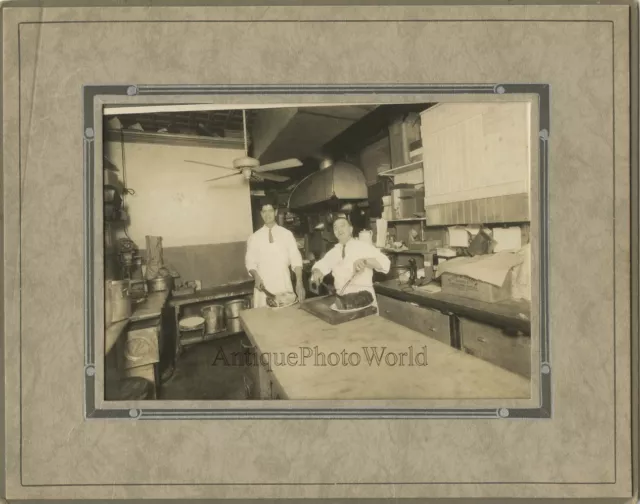 New York restaurant chefs in kitchen cutting meat with knives antique food photo