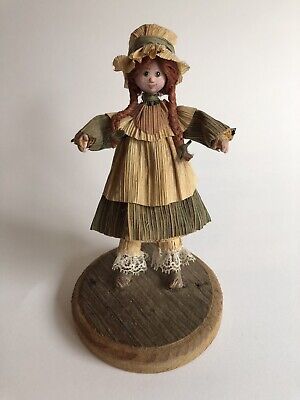 Hand Made Corn Husk Doll On Wooden Stand