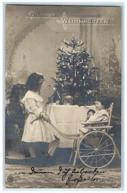 c1905 Christmas Tree Children High Chair Cart RPPC Photo Posted Antique Postcard