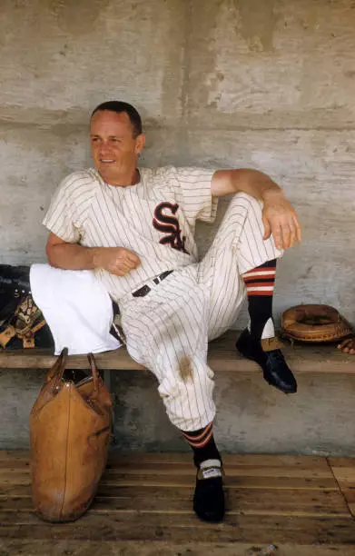 Chicago White Sox Nellie Fox sitting in dugout during spring train - Old Photo