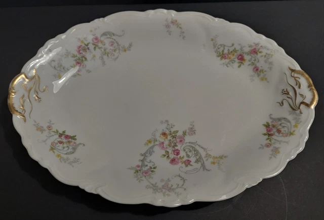 Plat de service ovale en porcelaine décor floral Charles Arhenfeldt Limoges