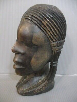 African art: tribal art, a wooden carved sculpture of young woman, Africa,60's