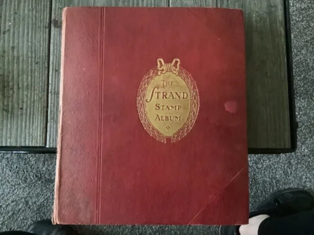 antique THE STRAND STAMP ALBUM with large collection of Stamps