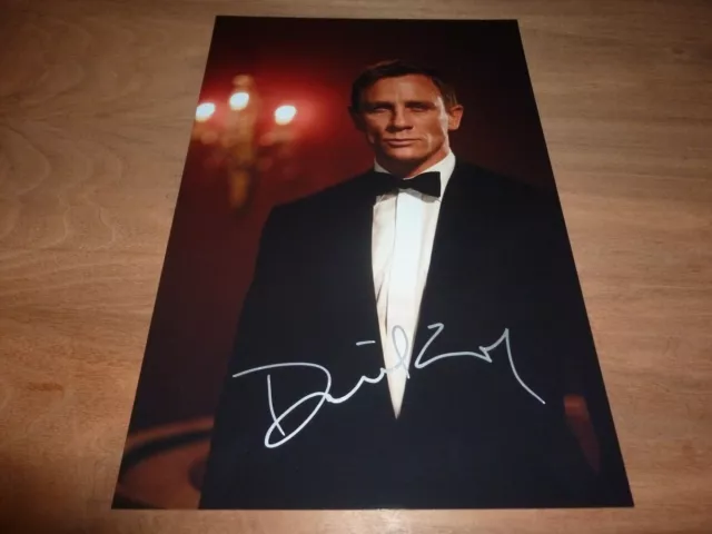 DANIEL CRAIG signed 12X8 photo JAMES BOND + COA