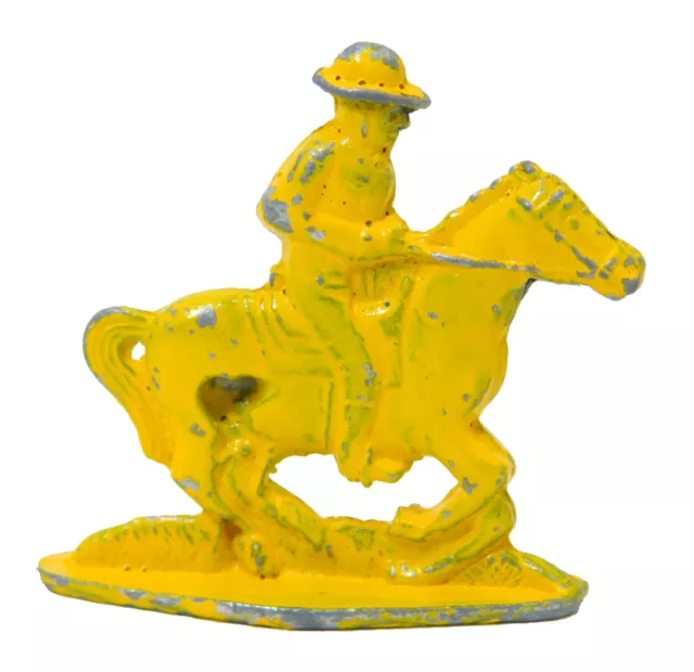 1910's CRACKER JACK PRIZE COWBOY ON HORSE GUN DRAWN METAL TOY STAND UP YELLOW