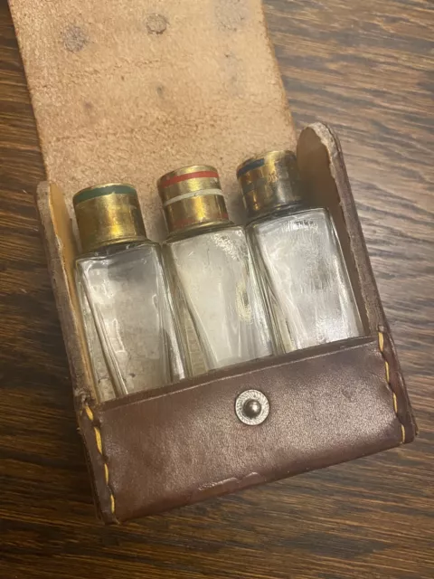 3 Miniature Antique Perfume Bottles In Leather Case