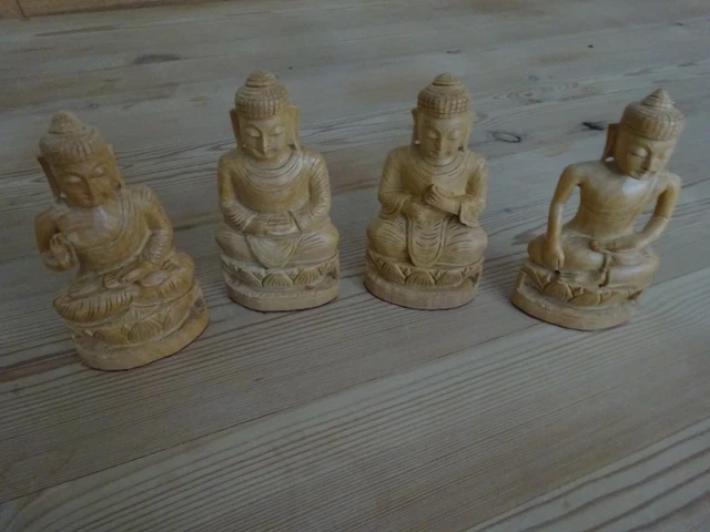 Buddha statues. Four, beautiful, hand-carved, wooden statues of Buddha