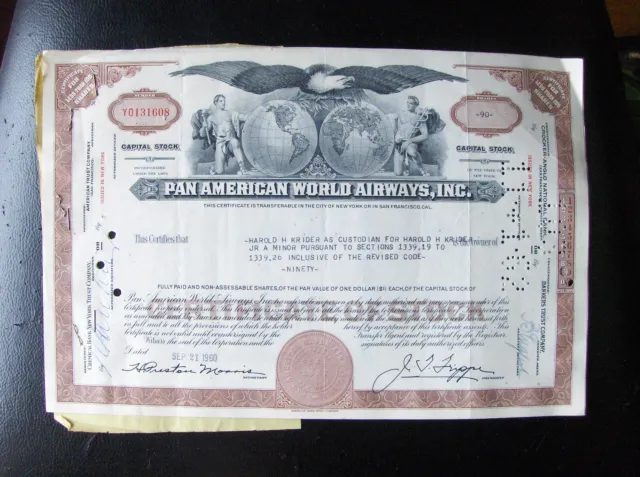 2 attached Pan American World Airways stock certificates. Broker Merrill Lynch 1