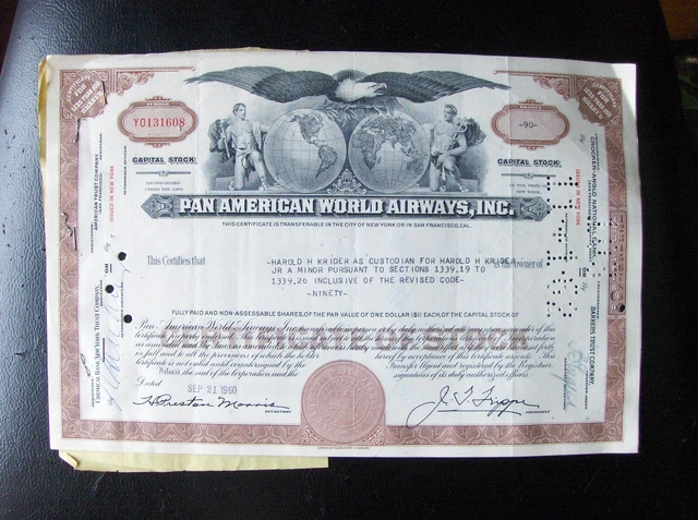 2 attached Pan American World Airways stock certificates. Broker Merrill Lynch 1