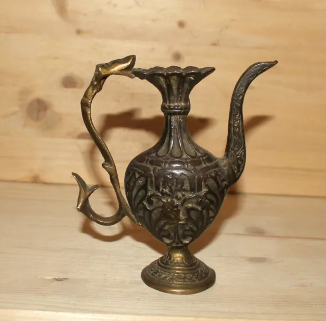 Antique hand made ornate bronze pitcher