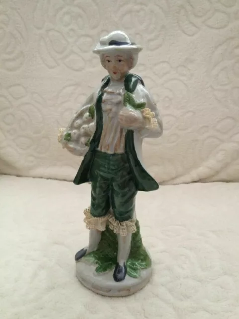 Ceramic figurine of gentleman in regency dress continental European with frills