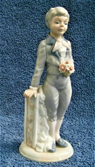 Q494) Vintage Casades porcelain boy with flowers figurine ornament